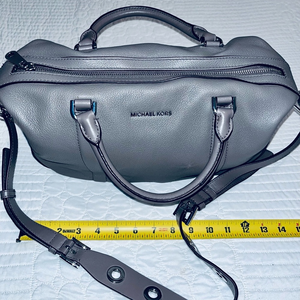 Michael Kors grey leather with silver accents.